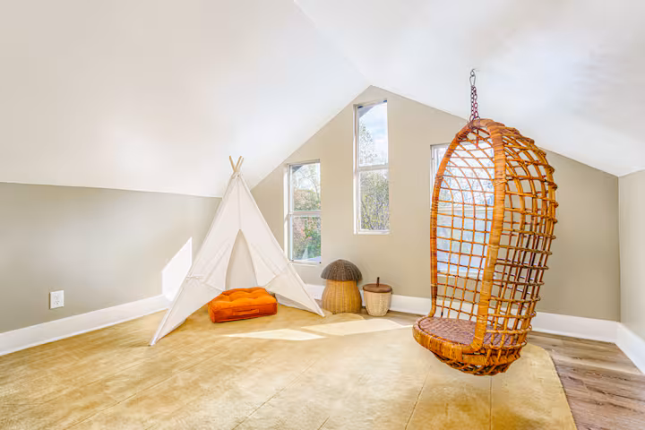 Cozy nook with a hanging wicker chair